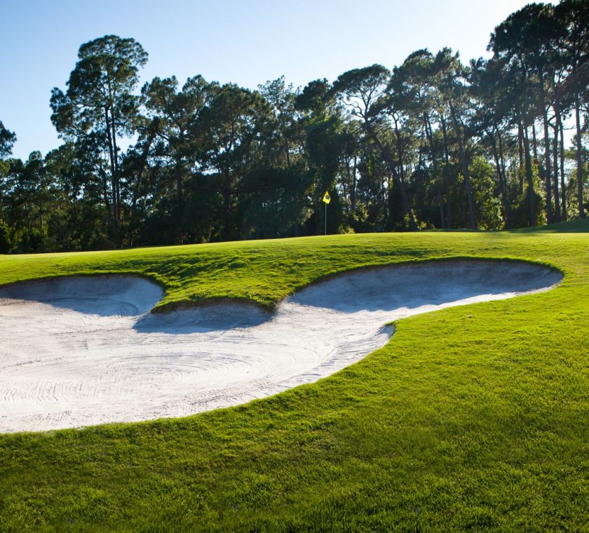 Bunker on golf course shaped like Mickey Mouse