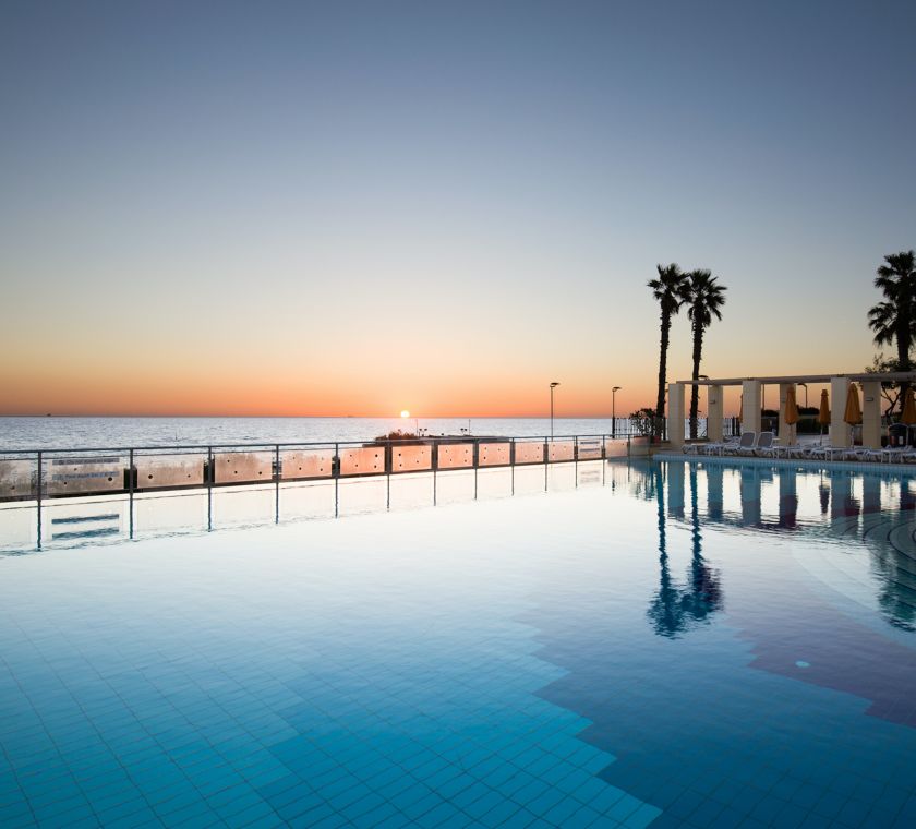 Horizon Pool overlooking the water, palm trees