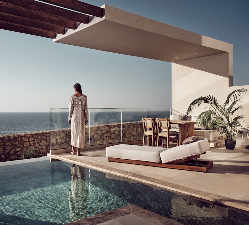 Woman Standing by Outdoor Private Pool Area of a Guest Room