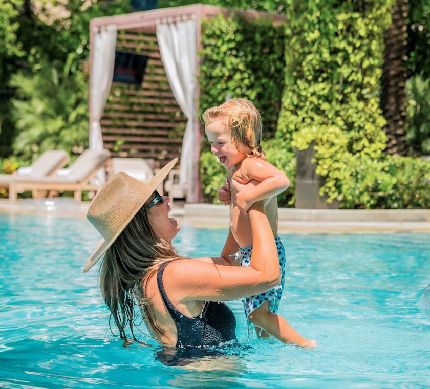 Mother and Son Having Fun in the Pool