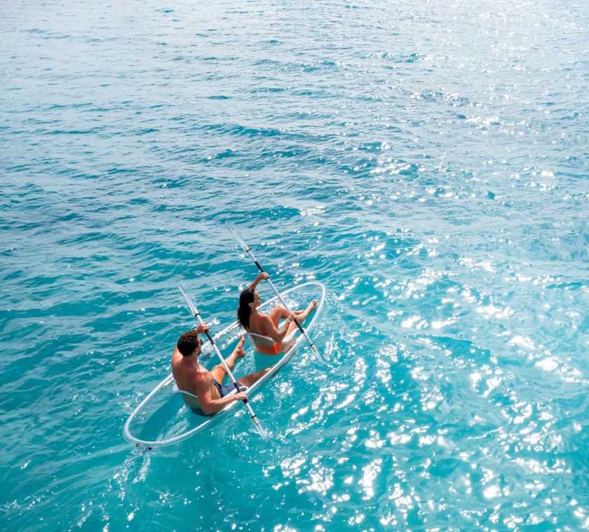 couple kayaking in the ocean