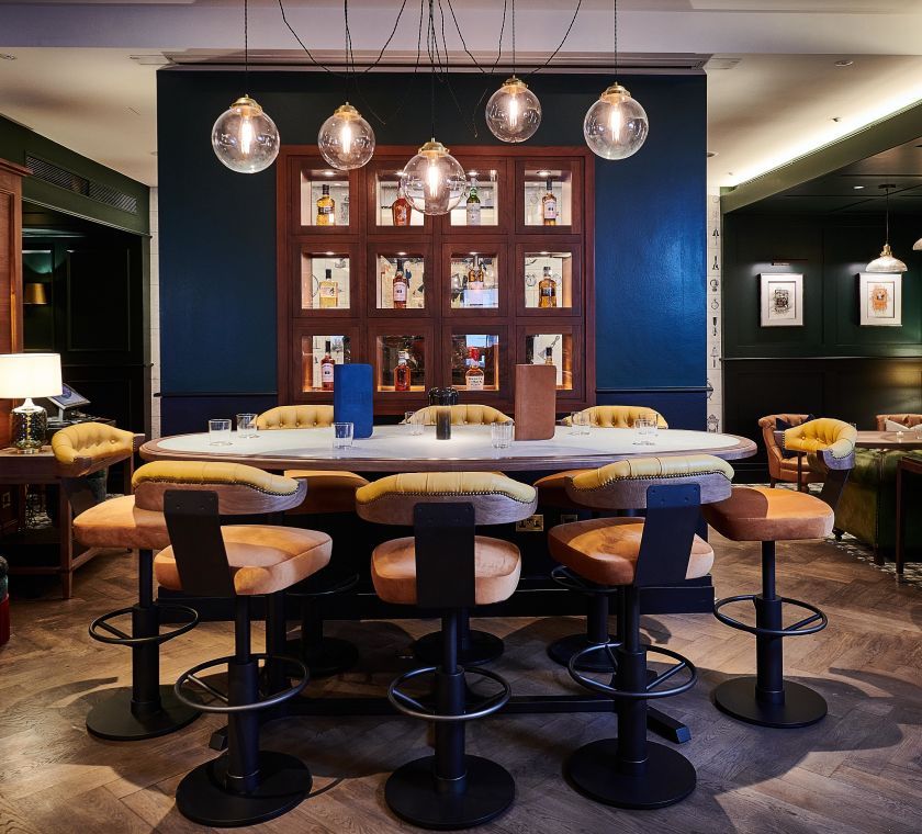 Restaurant seating area with tables and chairs