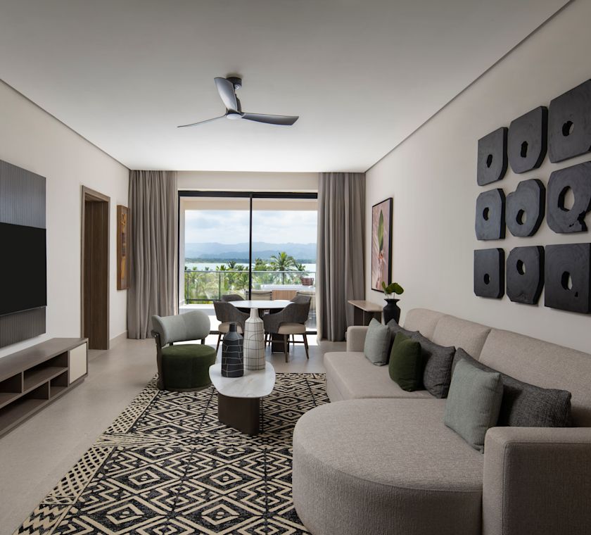 Lounge area with TV, comfortable seating area and tables