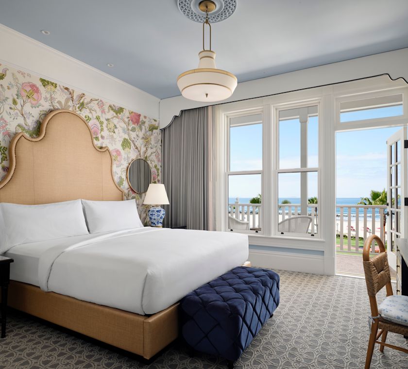 Victorian Guest Room with King Size Bed, End of Bed Bench, Work Desk, and Ocreanfront Balcony