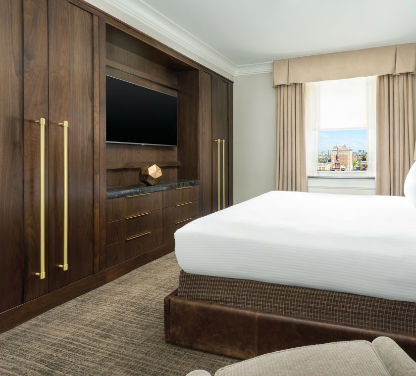 Bed in room with TV
