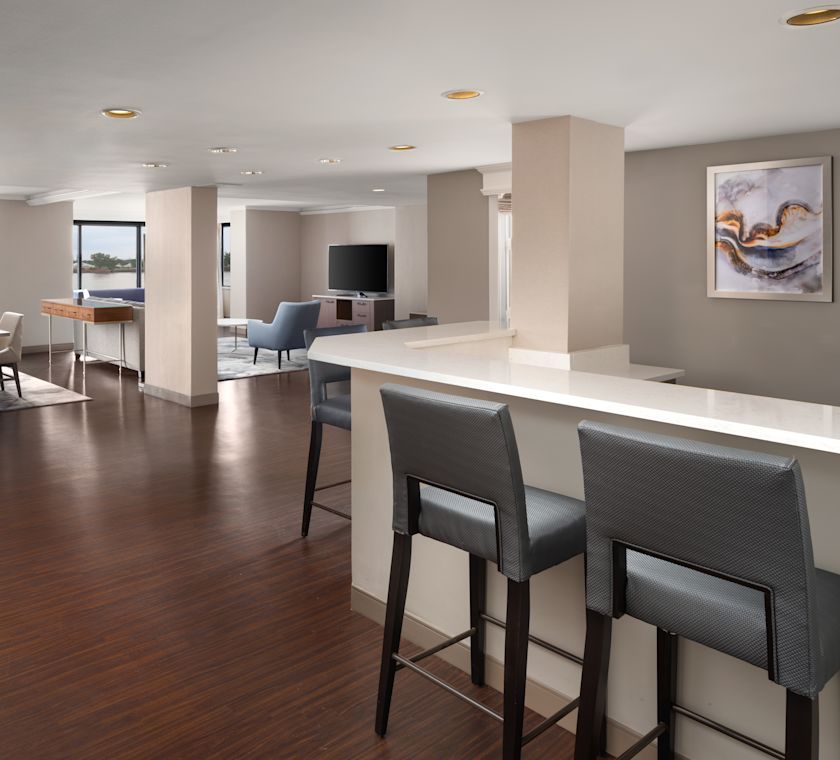 Living Room in a Suite with a Large Table and Chairs