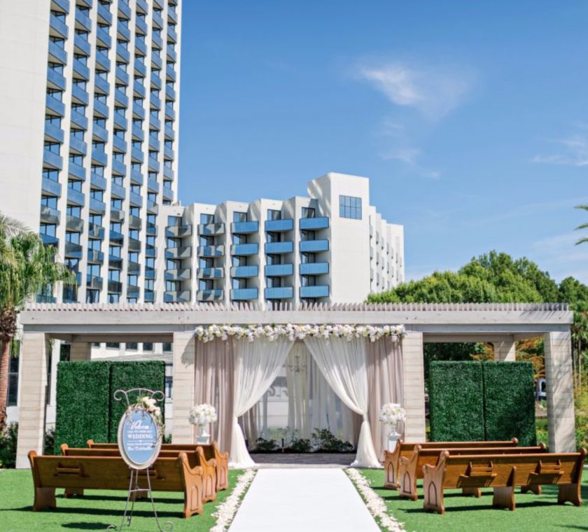 Benches in front of wedding pavillion with the hotel exterior behind