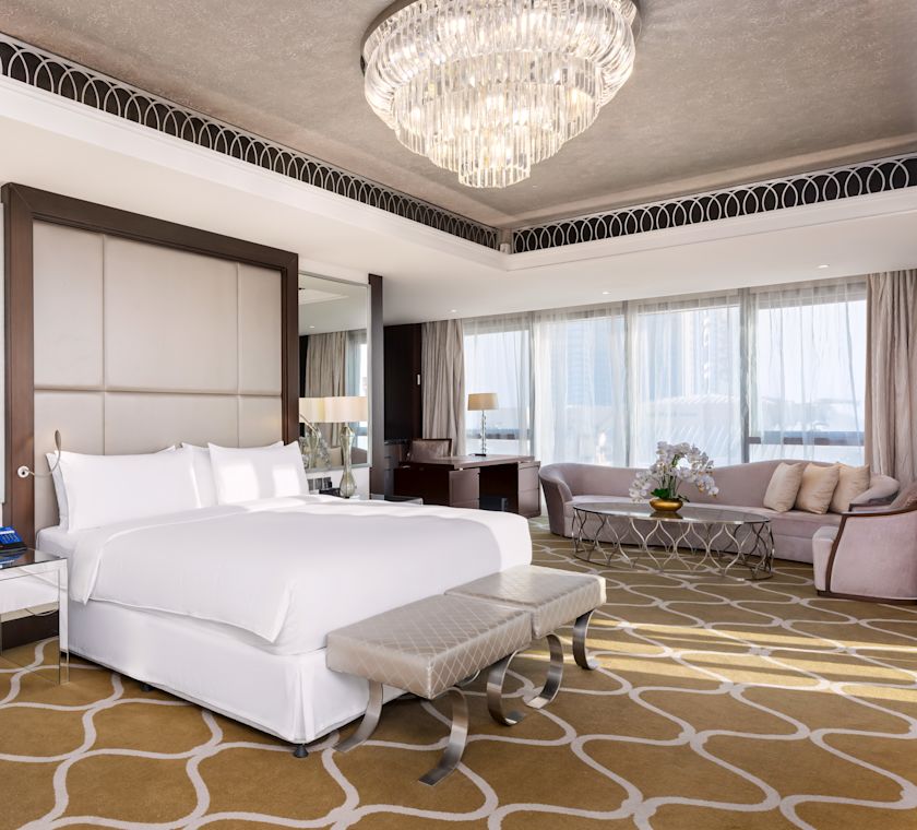 Large Bed and Sofa in a Hotel Suite