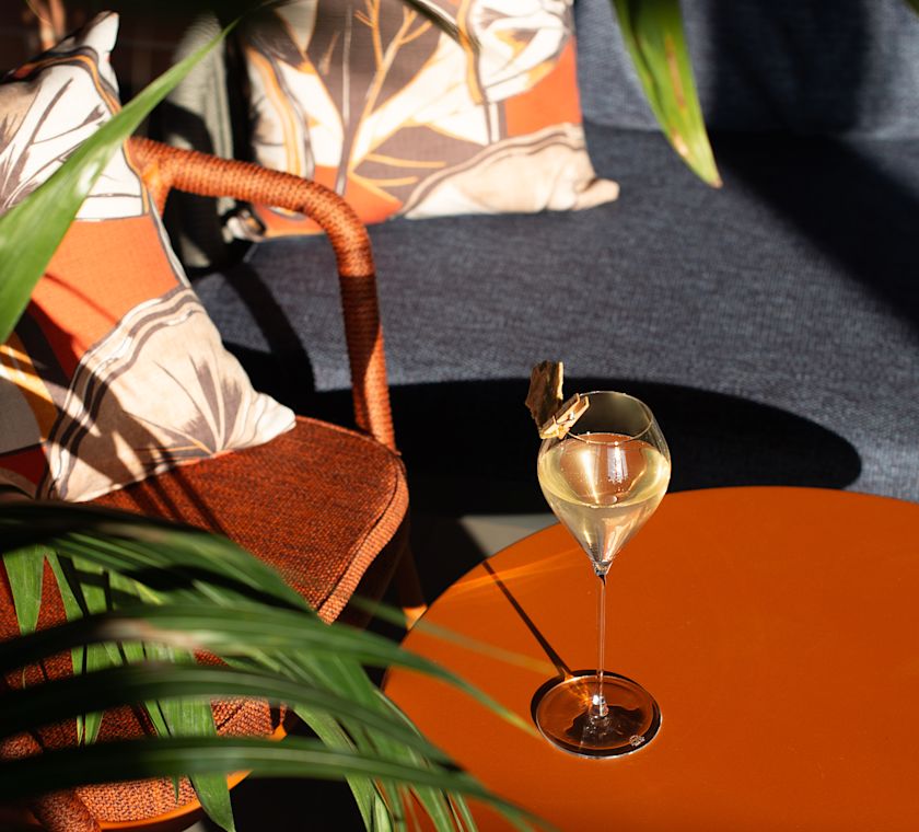 Skyline Rooftop Bar white wine glass in the sun