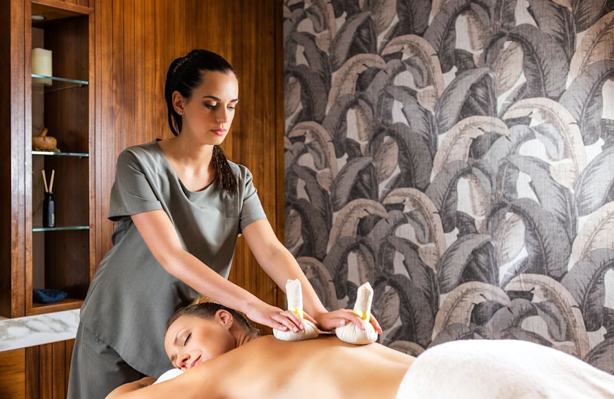 guest receiving a massage at the spa-transition
