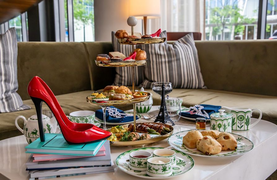 Food and a Red High Heel Shoe on a Table at Blue Aster Lounge-transition