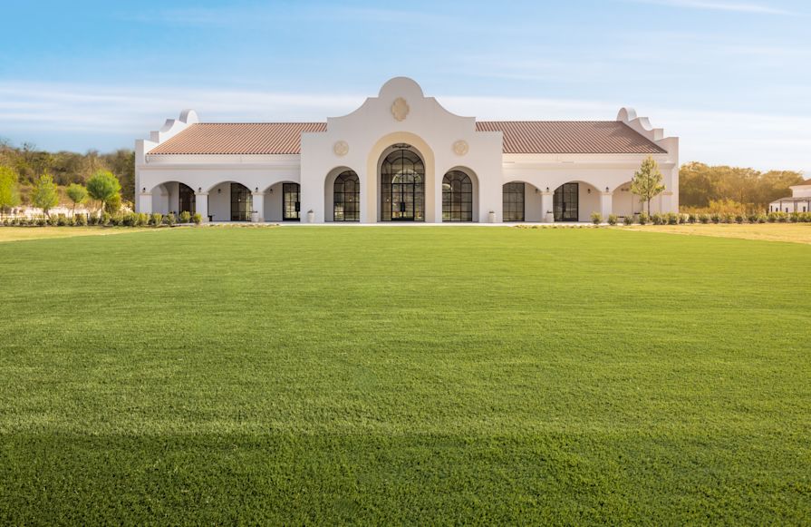 Exterior View of The Calera Meeting Venue with a Large Field in Front-transition