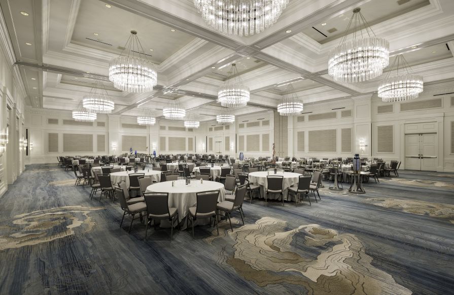 Ballroom image with chandeliers and circular table setup-transition