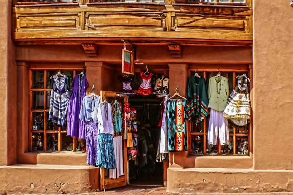 Mexican shop with clothing hanging outside