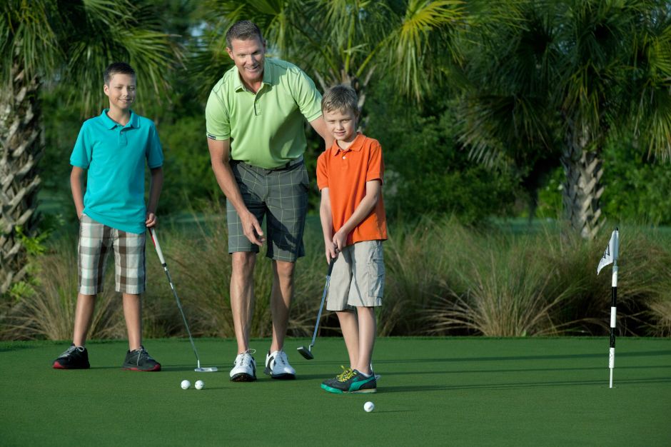 Man and Boys on Golf Course