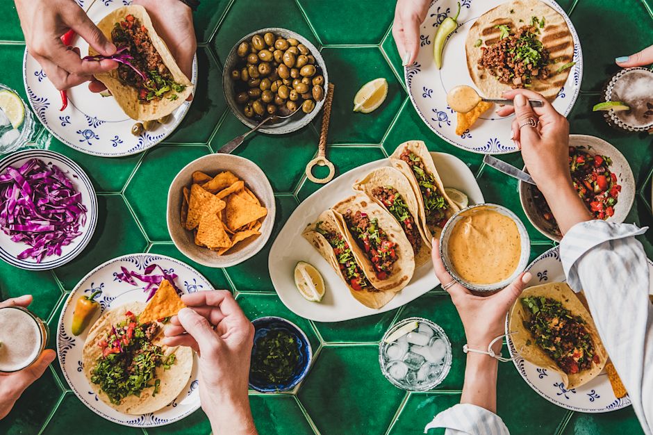Top-down view of table with array of food plates