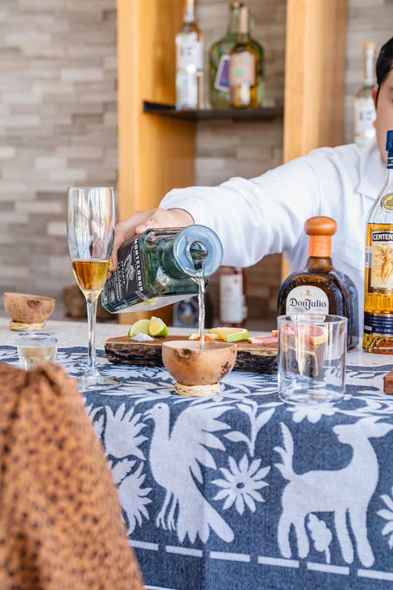 Man Pouring a Drinks at Maxal Restaurant