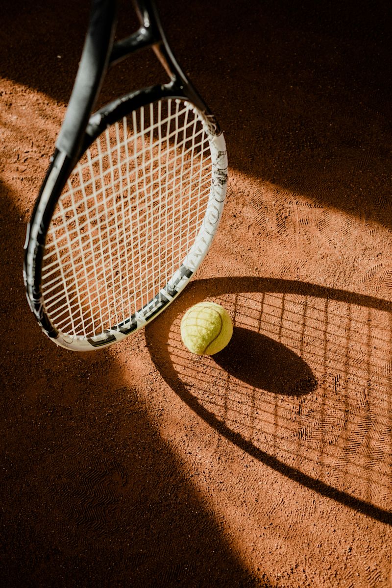 Tennis Racket and Ball on a Tennis Court