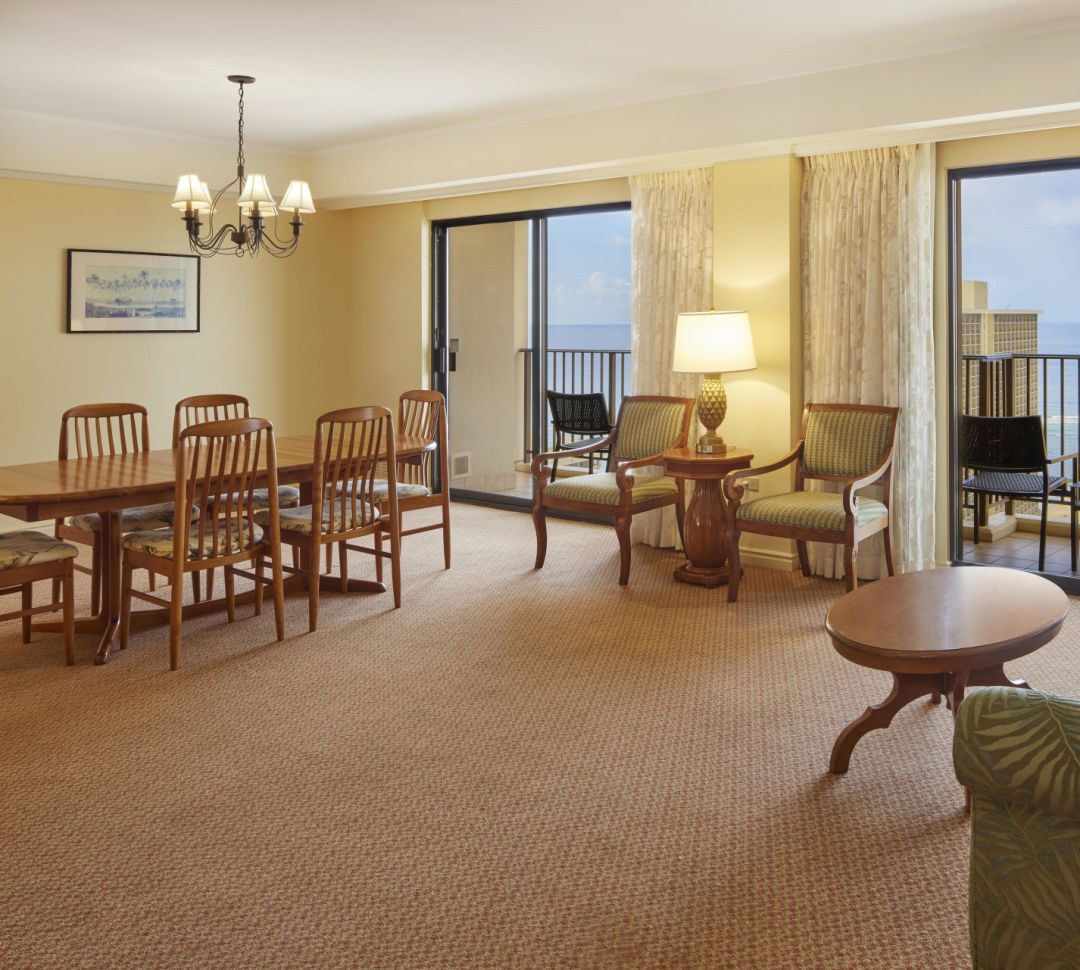 guest suite living area, sofa, dining table balcony view of the water-transition
