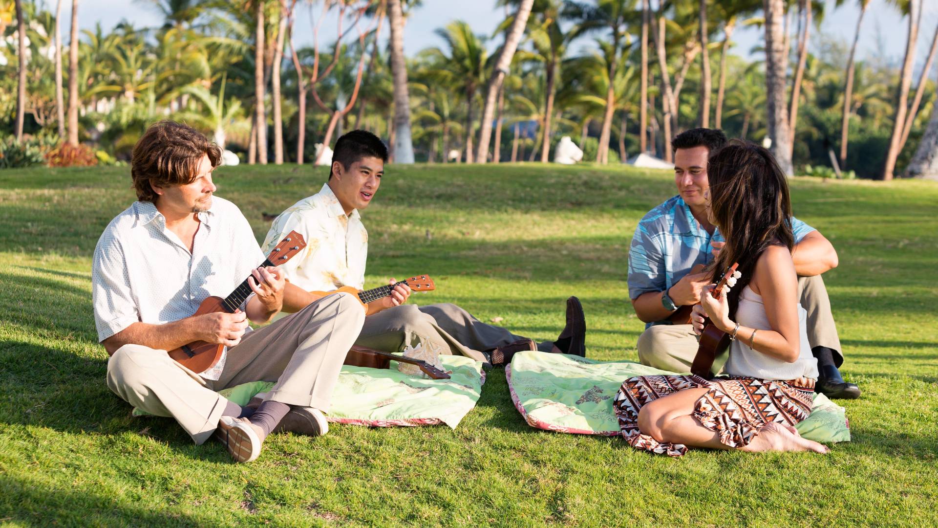 Group of people playing ukuleles