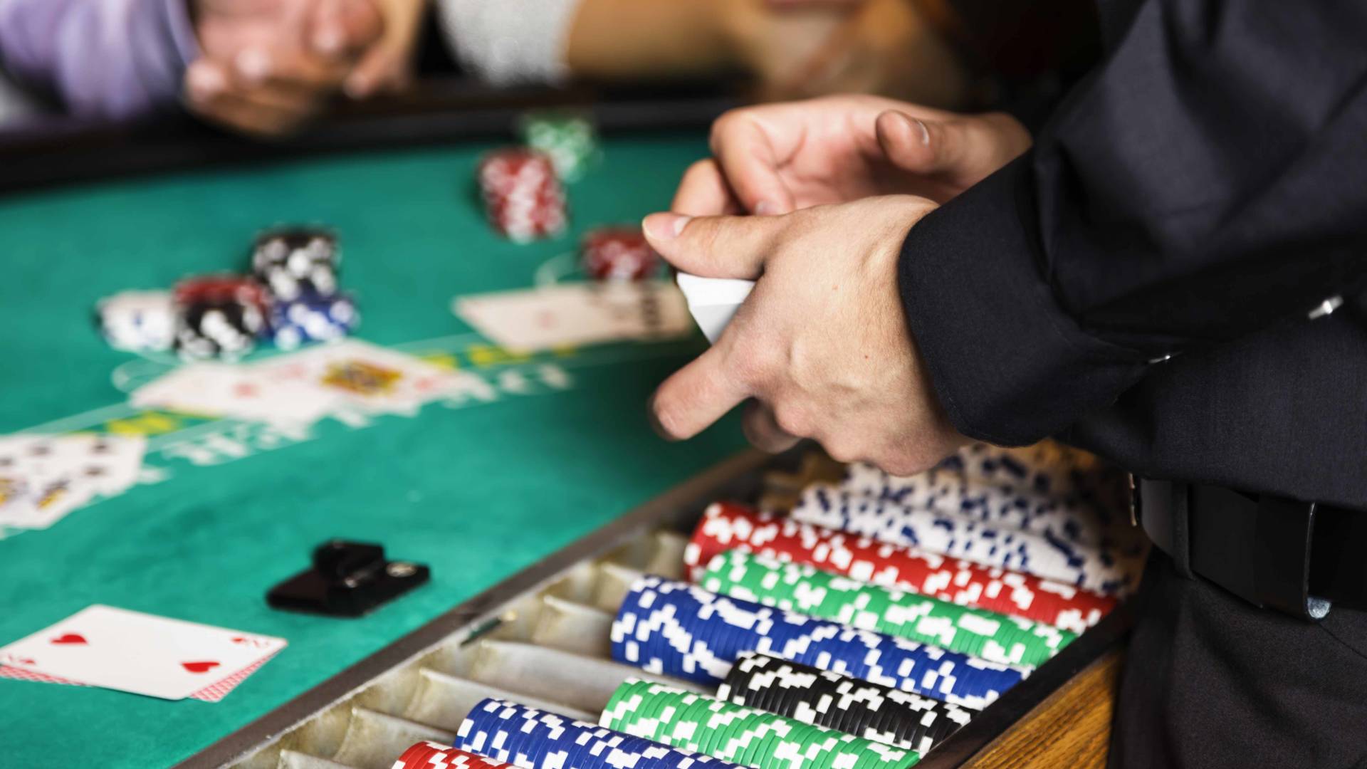 Close-up of dealer at casino table