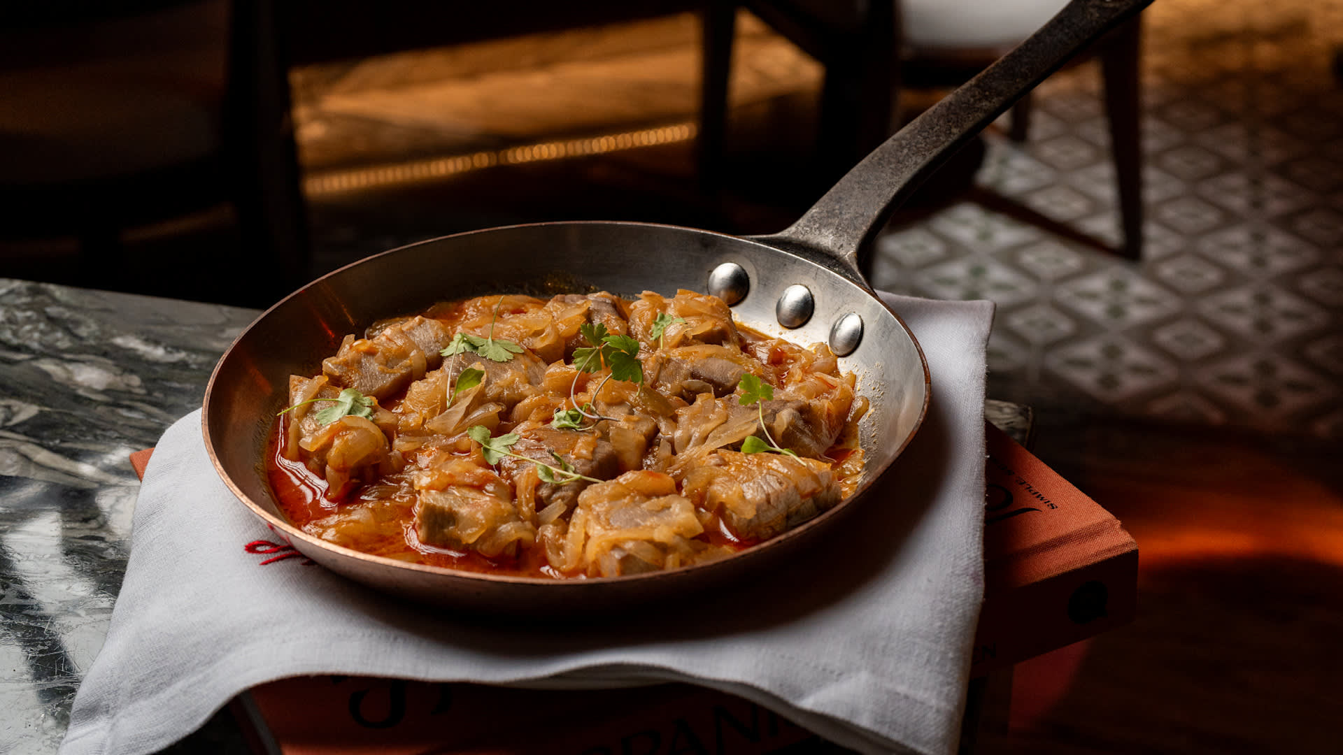 a Skillet with Food at Jose by Pizarro Restaurant