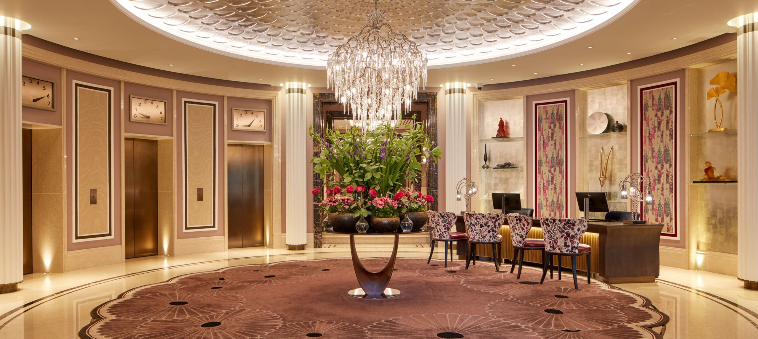 View of the lobby with crystal chandelier and luxury décor.
