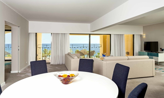 Deluxe suite dining and lounge area, window view