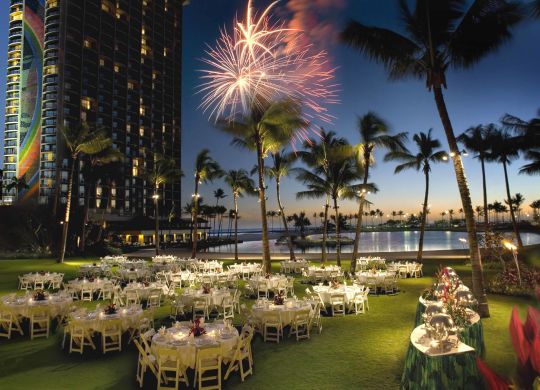 Events Outdoor event table setup with fireworks in sky