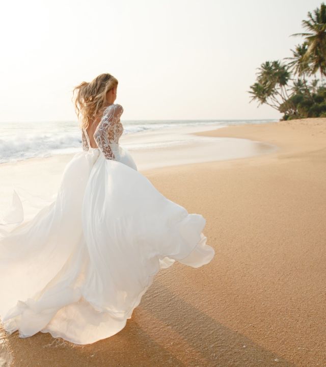 bride running on a beach