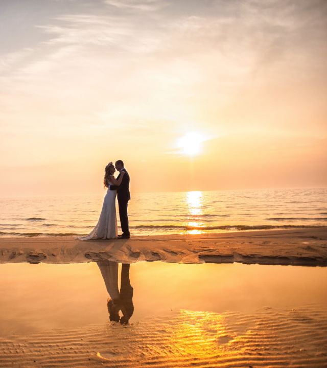 bride and groom in a sunset