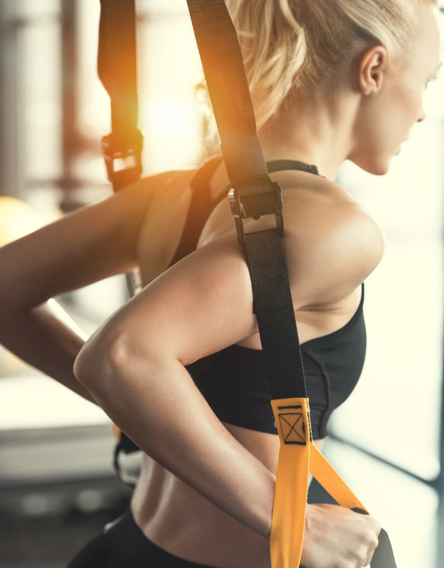 Woman working out with resistance bands