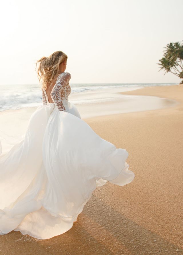 bride running on a beach