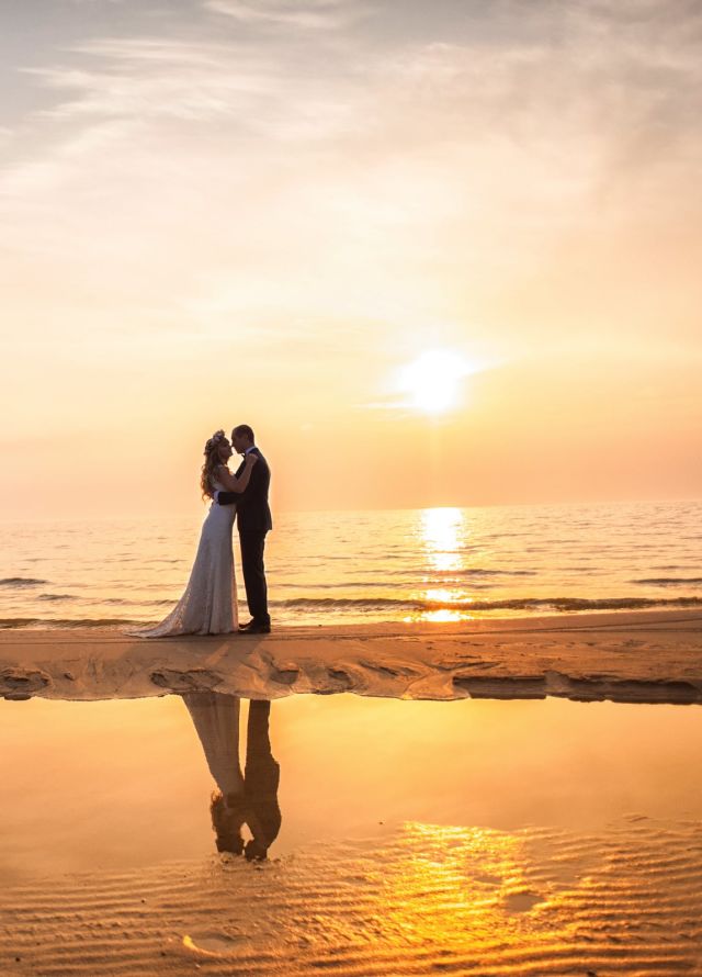 bride and groom in a sunset