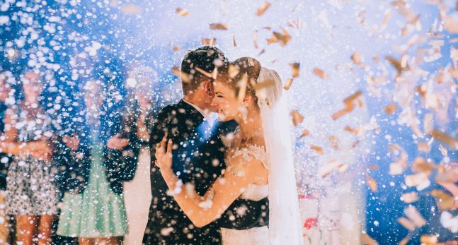 Confetti showering a bride and groom