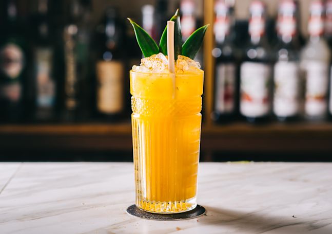 Tropical cocktail with leaf garnish
