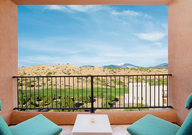 Balcony view with two chairs and table