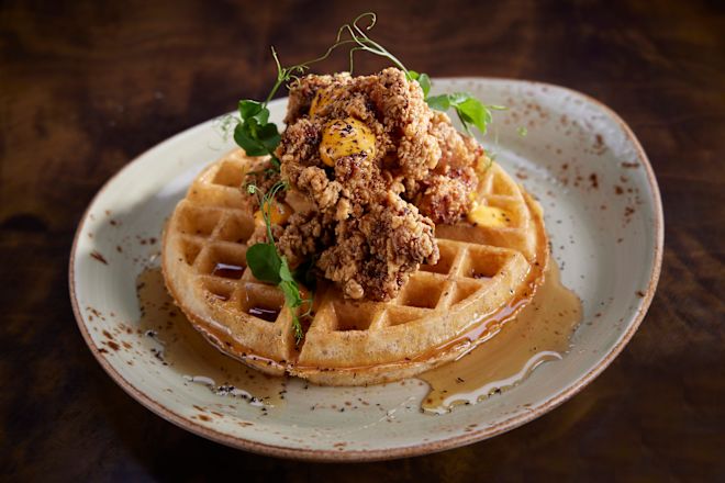 chicken and waffle on plate