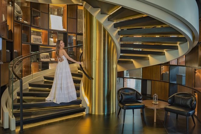 Woman on spiral stairs