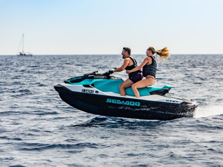 guests on a jet ski in the water