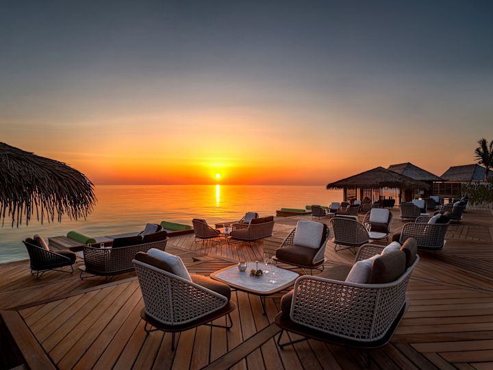Amber Bar outdoor seating at sunset