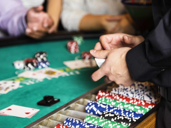 Close-up of dealer at casino table