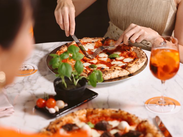 person eating a pizza