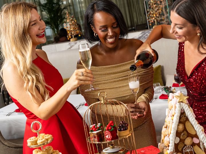 Nahaam restaurant, guests enjoying champagne holiday afternoon tea