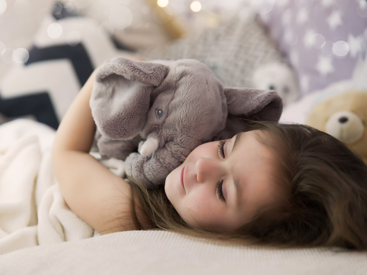Child with elephant cuddly toy