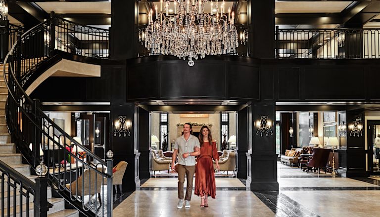 Couple Walking in Lobby Area
