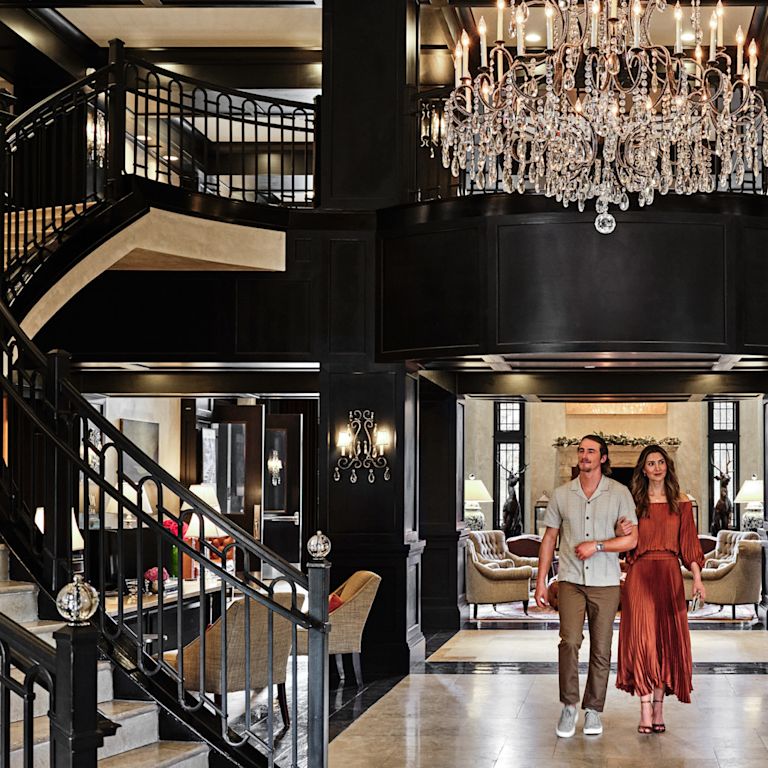 Couple Walking in Lobby Area